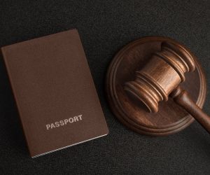 passports-judge-gavel-gray-black-background-legal-immigration-obtain-citizenship_renamed_5930